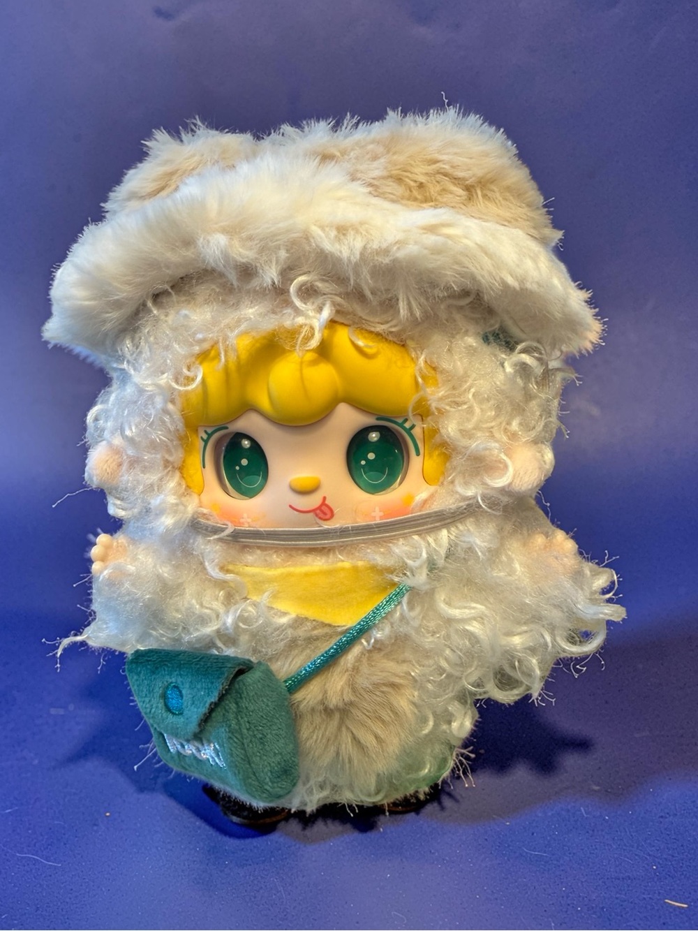 Yooki Yellow-faced Plush Doll in Cream Fuzzy Hood with Teal Bag